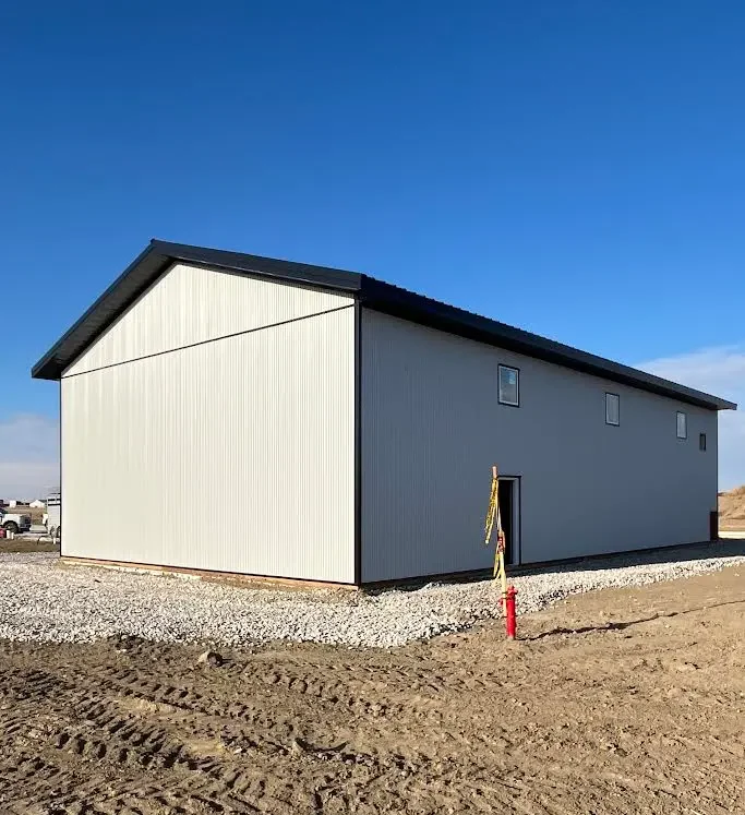 A white white post-frame lifestyle & hobby shop with premium wainscoting