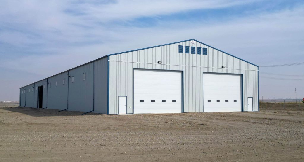 A Bone White post-frame agricultural storage building