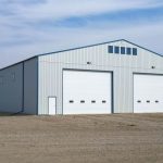 A Bone White post-frame agricultural storage building
