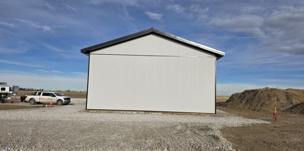 A white white post-frame lifestyle & hobby shop with premium wainscoting