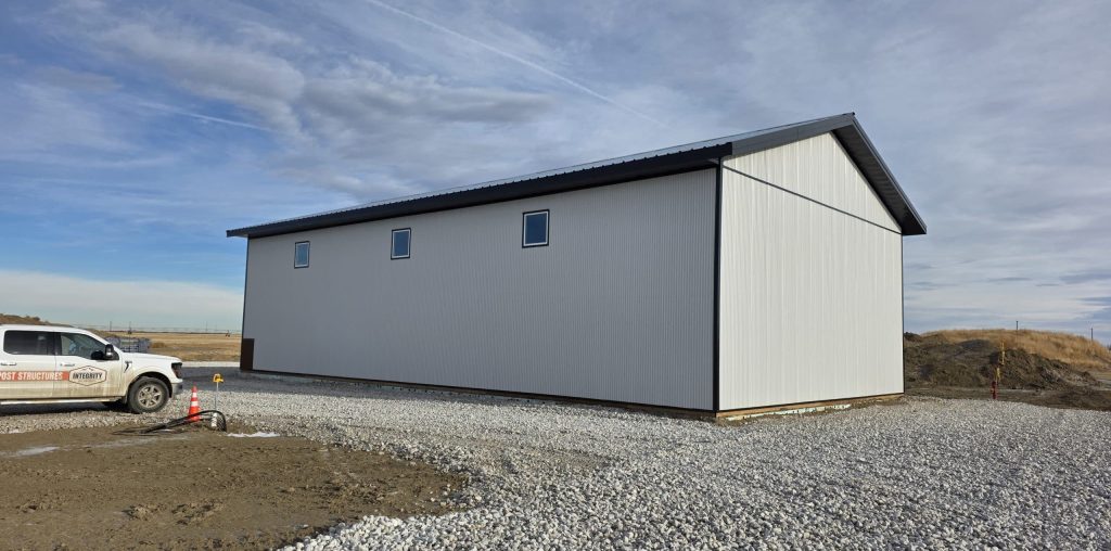 A white white post-frame lifestyle & hobby shop with premium wainscoting