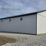 A white white post-frame lifestyle & hobby shop with premium wainscoting