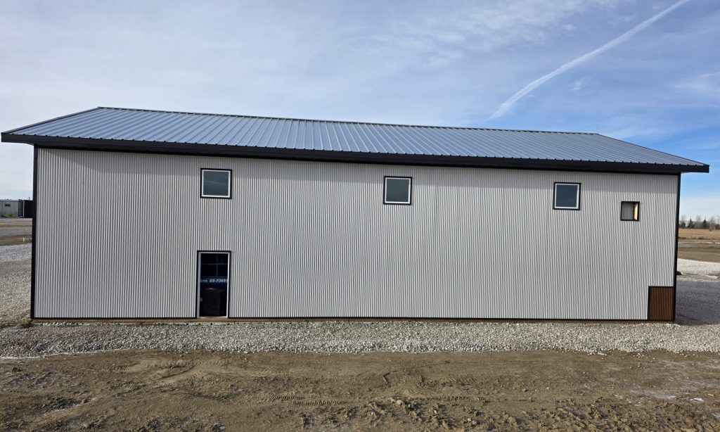 A white white post-frame lifestyle & hobby shop with premium wainscoting