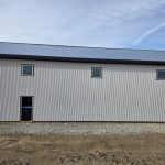 A white white post-frame lifestyle & hobby shop with premium wainscoting