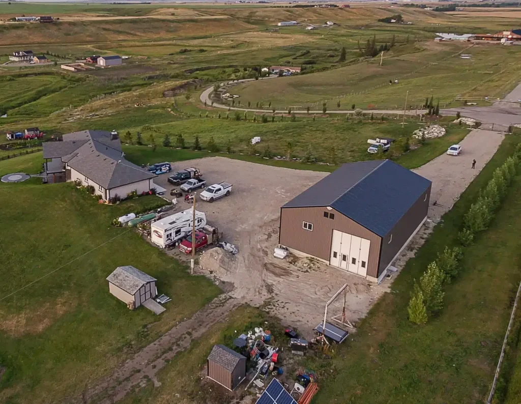 A charcoal post-frame agriculture shop with findoors