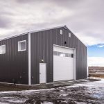 A charcoal post-frame lifestyle & hobby shop with overhead doors