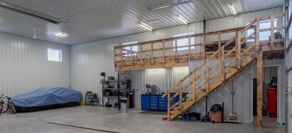 A charcoal post-frame lifestyle & hobby shop with overhead doors