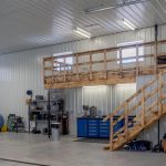 A charcoal post-frame lifestyle & hobby shop with overhead doors
