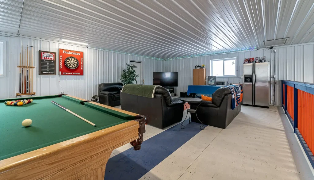 An ascot grey post-frame lifestyle & Hobby shop with an overhead door