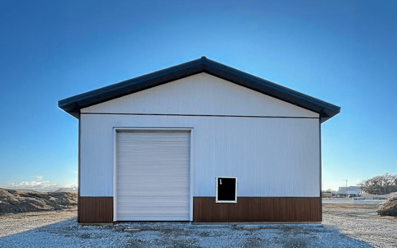 A white white post-frame commercial shop with premium espresso wainscoting