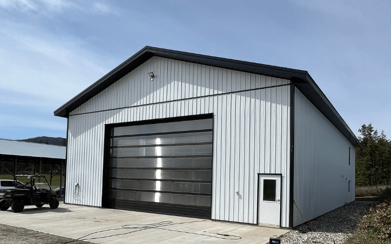 A bright white post-frame lifestyle and hobby shop or storage