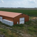 A copper penny post-frame agriculture storage building