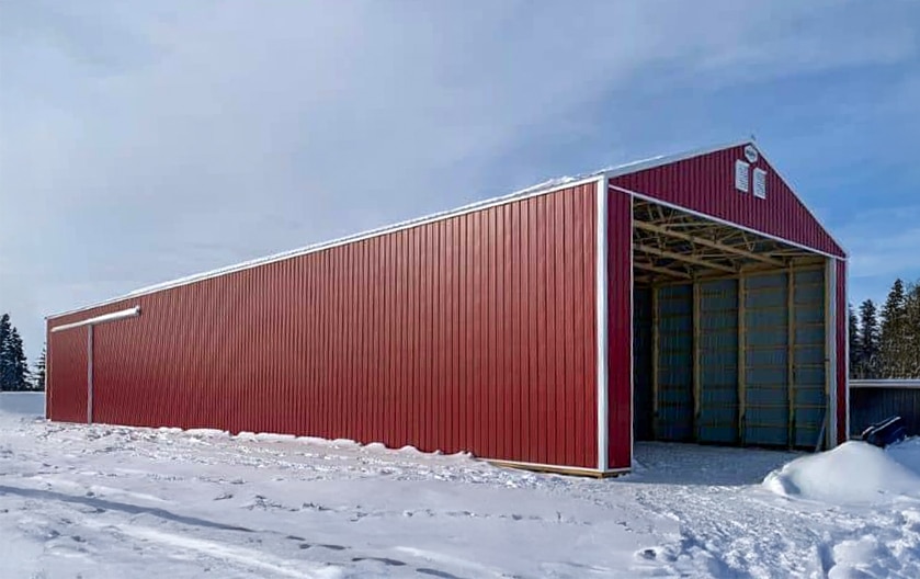 A dark red equestrian open Hay Shed with sliding doors