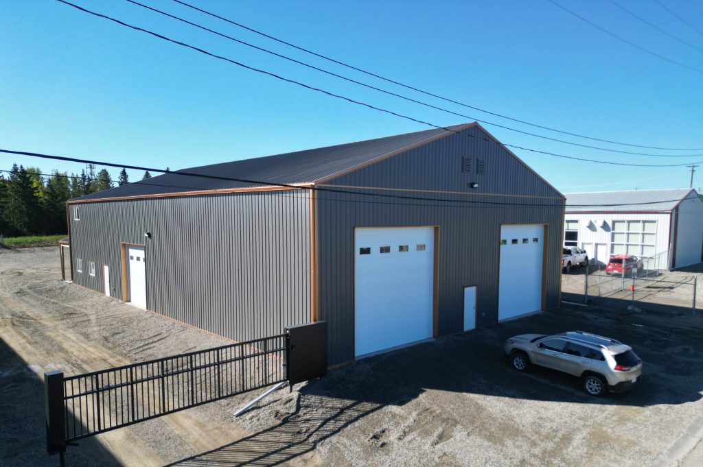 A charcoal agriculture and commercial post-frame storage shop with copper penny trims