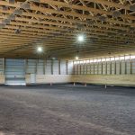 A sable post-frame commercial riding arena