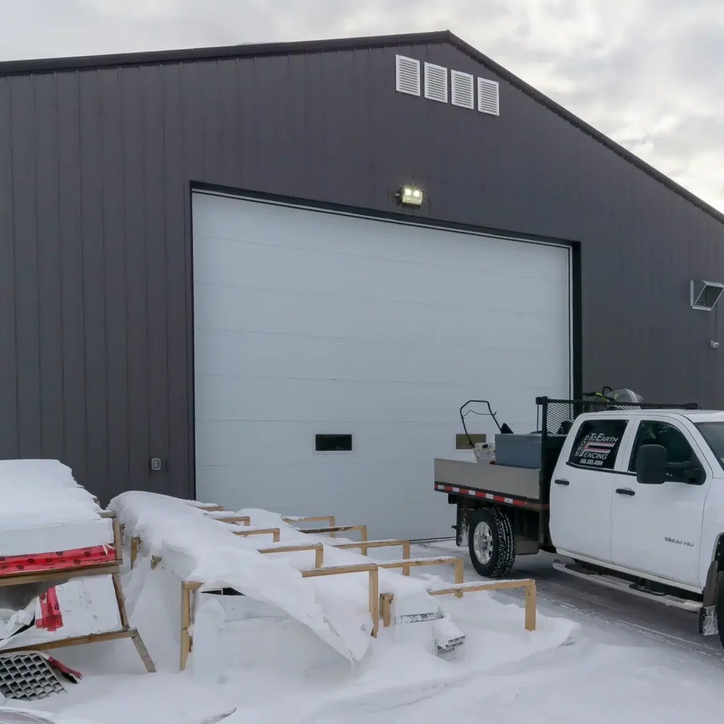 Explore the custom commercial shop built for Derek of Down To Earth Fencing Inc near Regina, SK. A rugged, high-capacity facility engineered for the Saskatchewan climate.