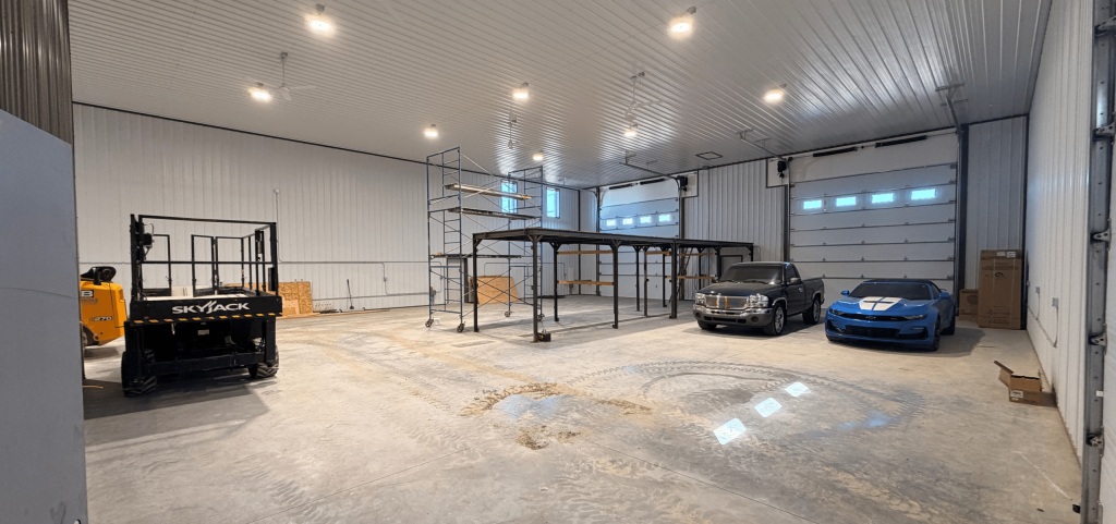 A charcoal agriculture and commercial post-frame storage shop with copper penny trims