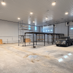 A charcoal agriculture and commercial post-frame storage shop with copper penny trims