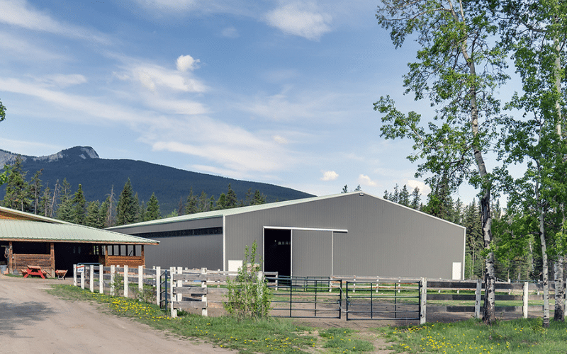 A sable post-frame commercial riding arena