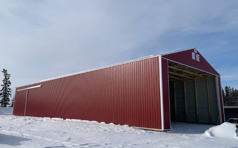 A dark red equestrian open Hay Shed with sliding doors