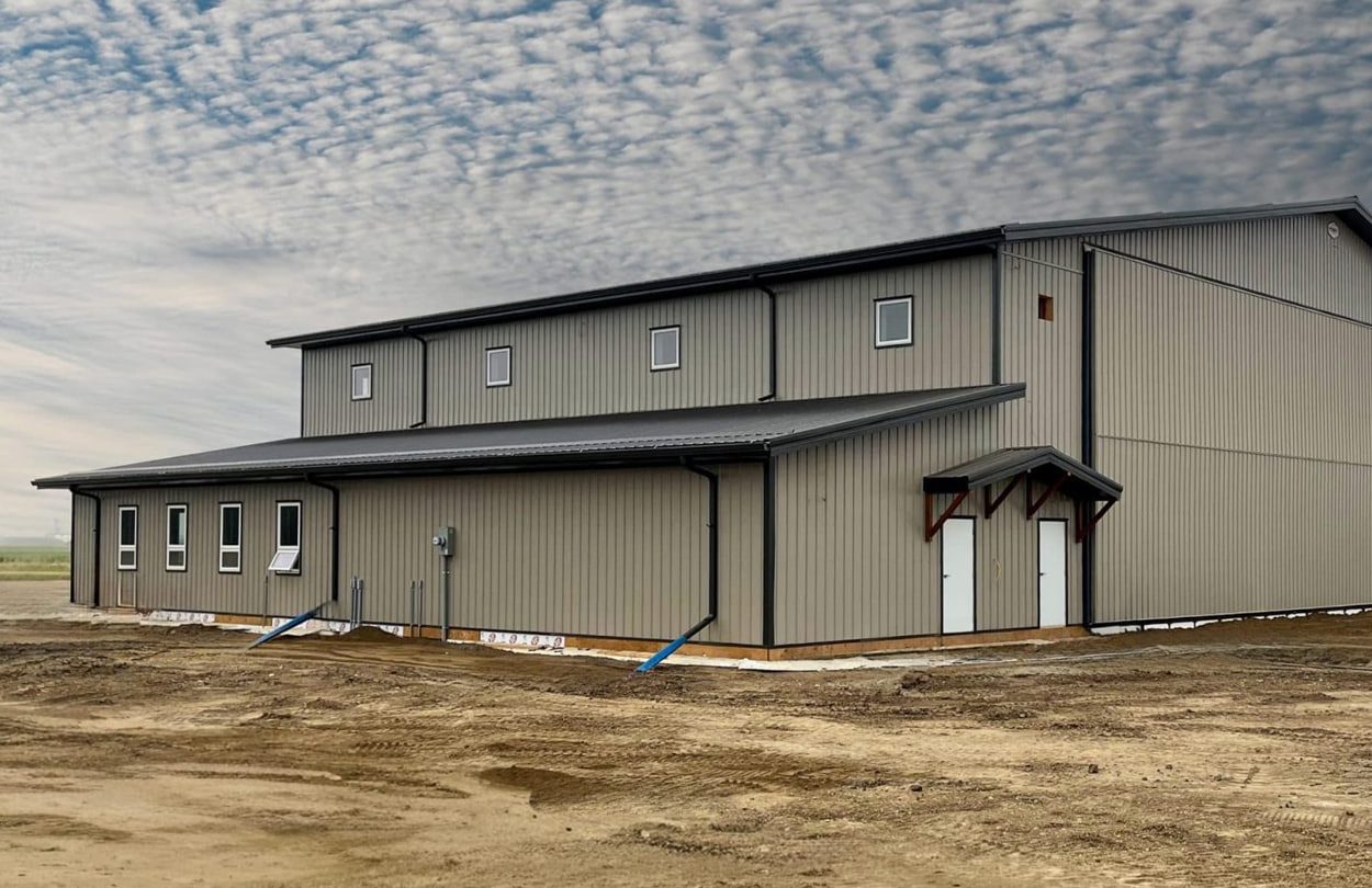 A post-frame shop with a closed lean-to