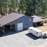 A bluebird post-frame custom residential suite with a garage and open lean-to