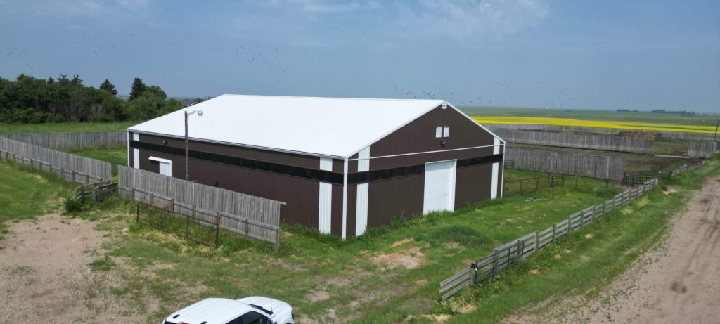 Explore the custom barn and livestock shelter built for Bryan of Wilbar Cattle Co near Dundurn, SK. Engineered for cattle protection and heavy prairie weather.