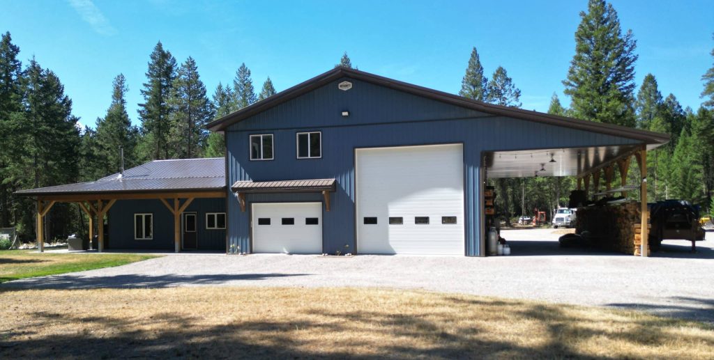 A bluebird post-frame custom residential suite with a garage and open lean-to