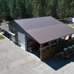 A bluebird post-frame custom residential suite with a garage and open lean-to