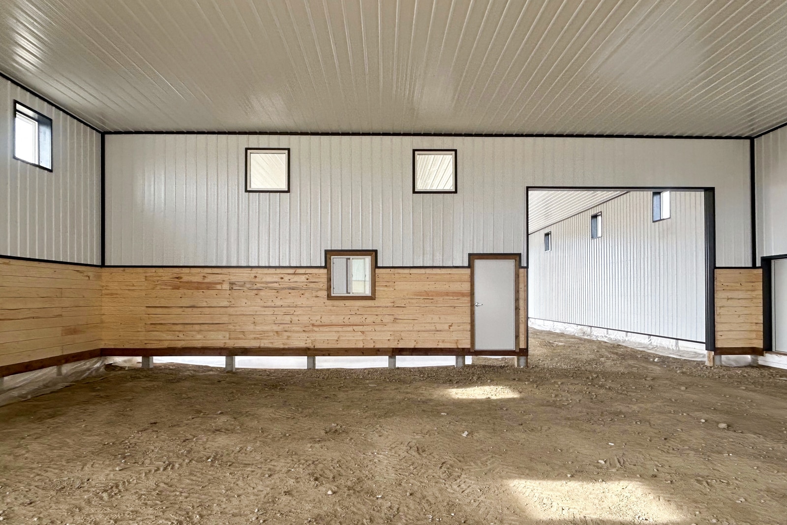 Partition wall in a post-frame building