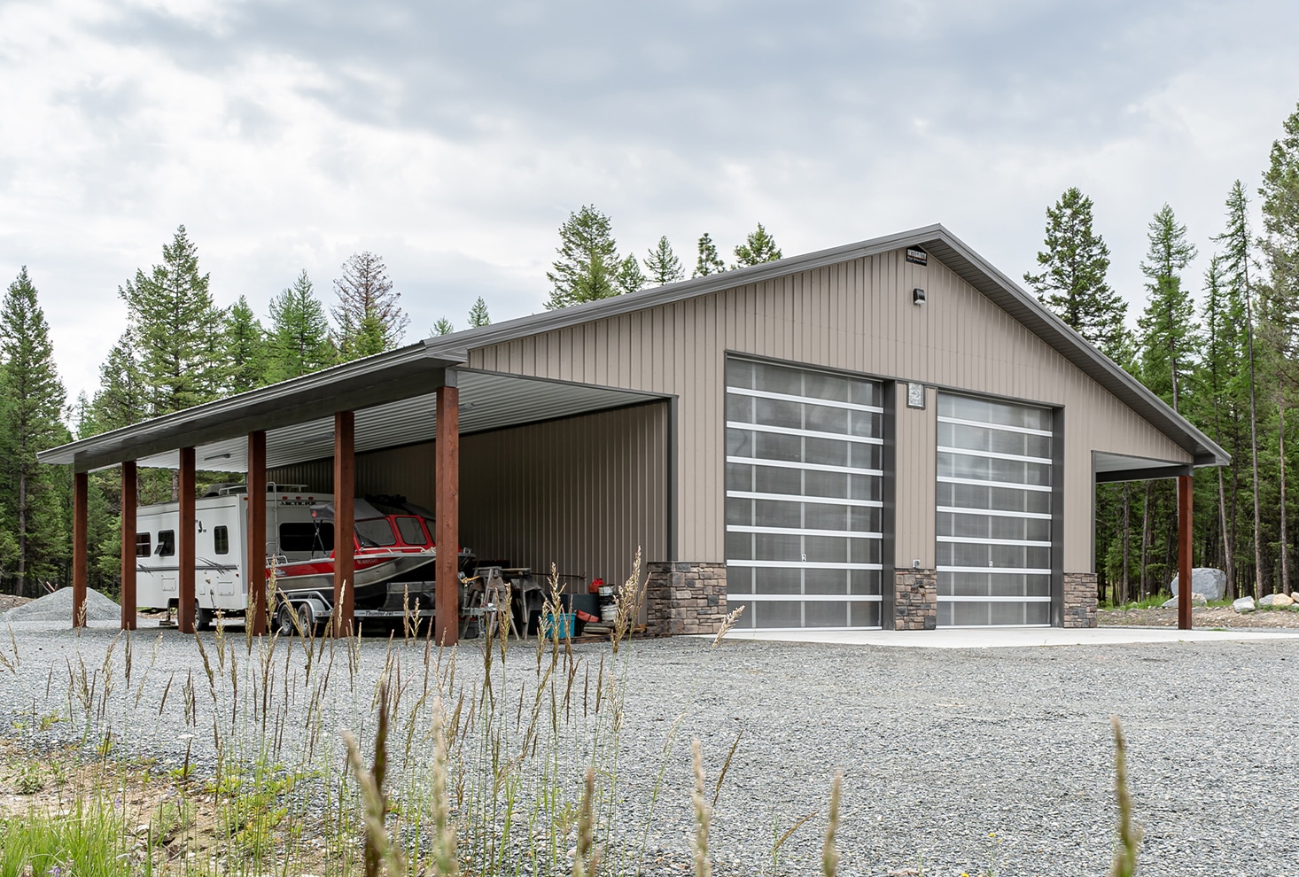Post-frame shop with two open lean-tos built by Integrity Post Structures