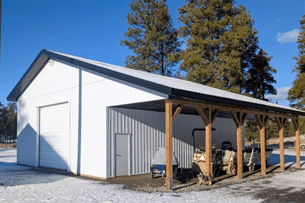 A post-frame shop with an open lean-to