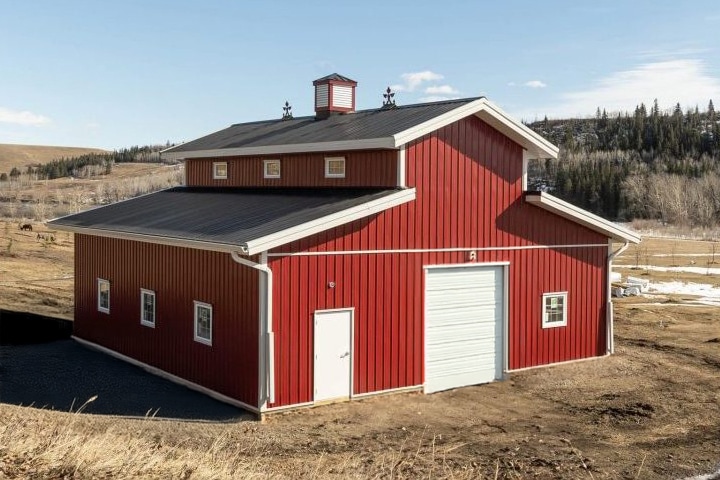 Cute red Post-frame barn built by Integrity Post Structures