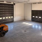 A post-frame residential barndominium with buckskin walls and coffee brown wainscoting