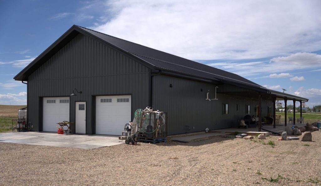 A gunmetal post-frame residential Ranch Hand