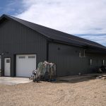A gunmetal post-frame residential Ranch Hand