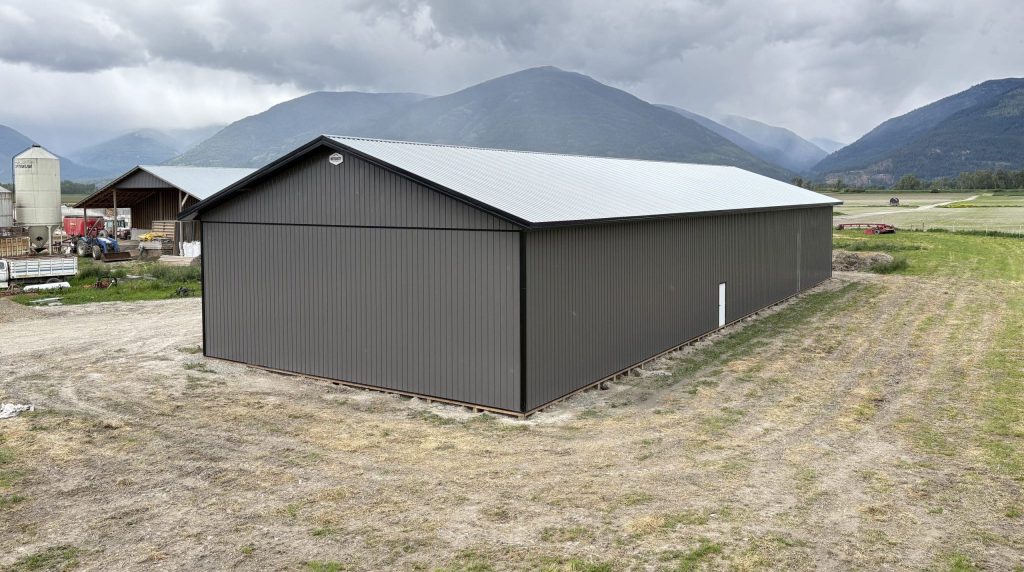 A charcoal post-frame agriculture storage building