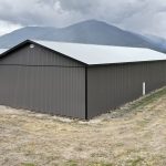 A charcoal post-frame agriculture storage building