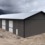 A charcoal post-frame agriculture storage building