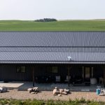 A gunmetal post-frame residential Ranch Hand