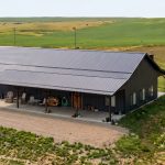 A gunmetal post-frame residential Ranch Hand