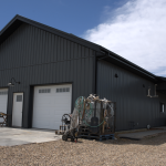 A gunmetal post-frame residential Ranch Hand
