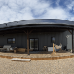 A gunmetal post-frame residential Ranch Hand