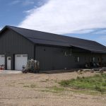 A gunmetal post-frame residential Ranch Hand