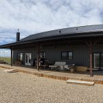 A gunmetal post-frame residential Ranch Hand