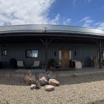 A gunmetal post-frame residential Ranch Hand