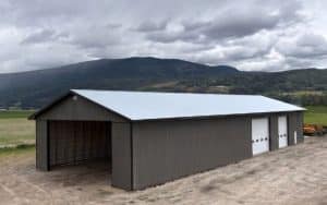 A charcoal post-frame agriculture storage building