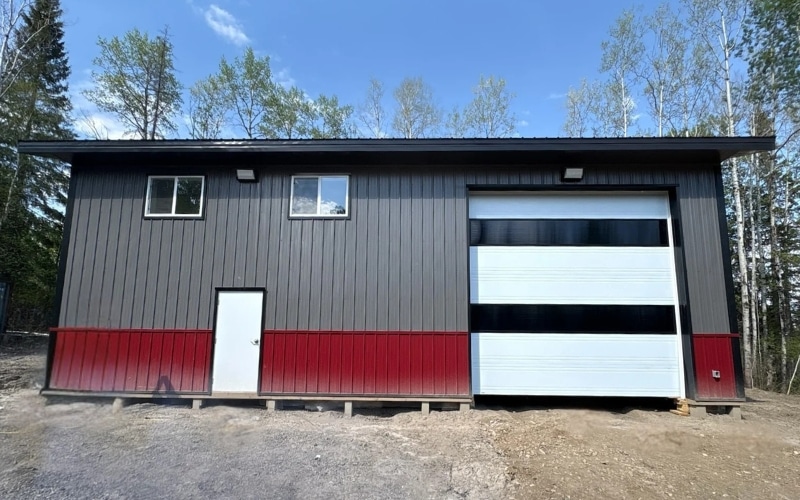 A charcoal post-frame shop with dark red wainscoting
