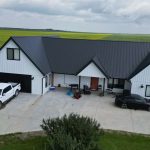 Explore the custom Homestead with loft built for Tyler near Kindersley, SK. Features upgraded Board and Batten Bright White siding and a functional, high-capacity design.