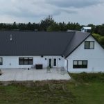Explore the custom Homestead with loft built for Tyler near Kindersley, SK. Features upgraded Board and Batten Bright White siding and a functional, high-capacity design.